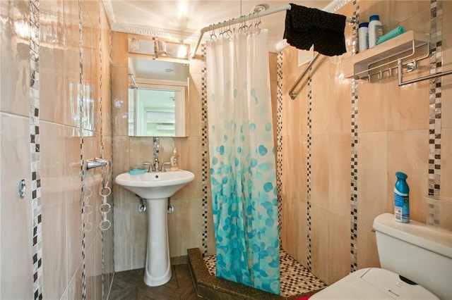 bathroom with parquet floors, walk in shower, crown molding, toilet, and tile walls