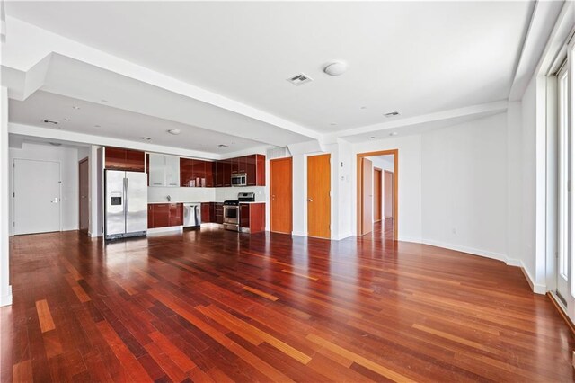 unfurnished living room with hardwood / wood-style floors