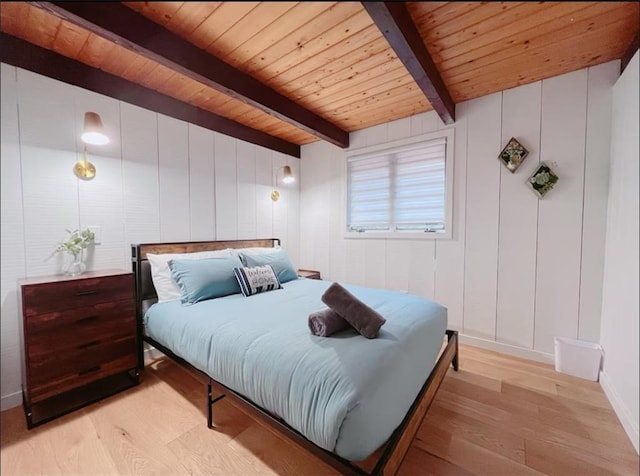 bedroom featuring wood ceiling, beamed ceiling, and light wood-type flooring