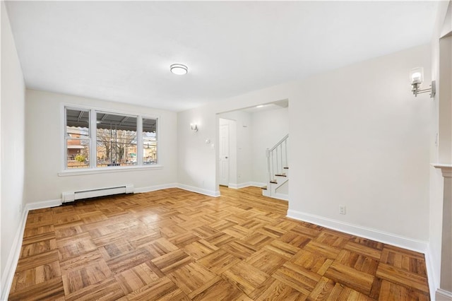 unfurnished room featuring light parquet flooring and a baseboard radiator