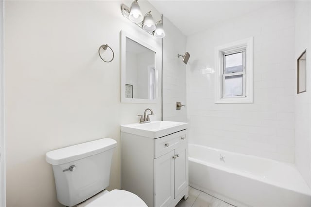 full bathroom with tile patterned flooring, vanity, toilet, and tiled shower / bath