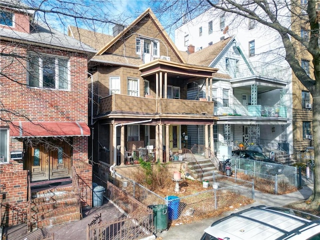 view of front of house with a balcony