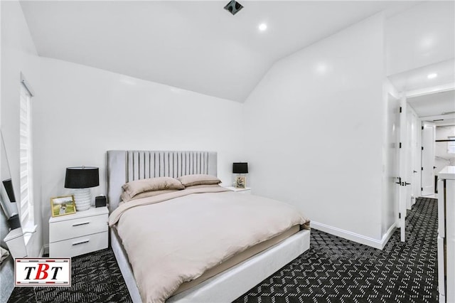 bedroom featuring carpet floors and vaulted ceiling