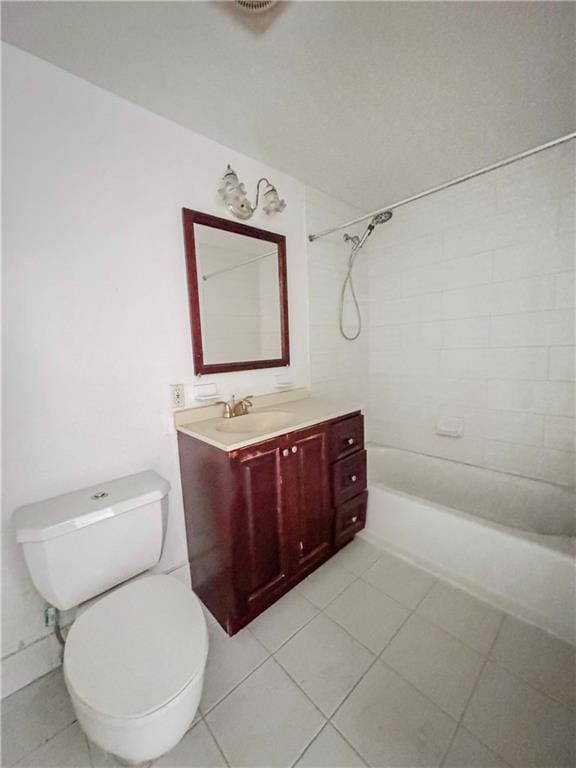 full bathroom featuring toilet, vanity, tile patterned floors, and tiled shower / bath