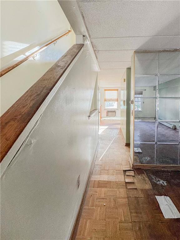 hall featuring baseboards