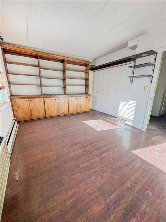 garage with a baseboard heating unit