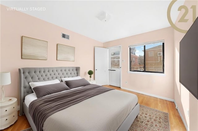 bedroom with light hardwood / wood-style flooring