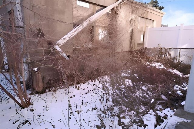 view of property with a balcony and a garage