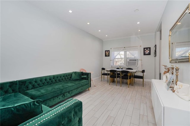 living area with crown molding, light wood finished floors, recessed lighting, cooling unit, and baseboards