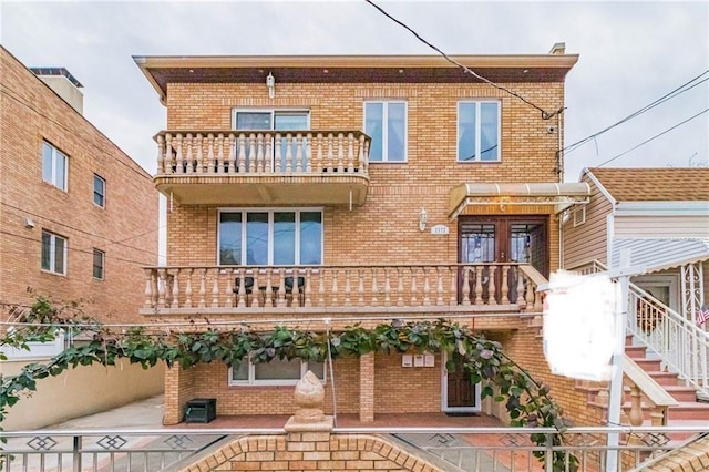 2572 W 16th St, Brooklyn, NY 11214 - back of property featuring a balcony and brick siding