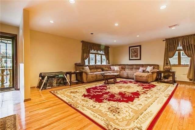 2572 W 16th St, Brooklyn, NY 11214 - living room featuring light wood finished floors, recessed lighting, and radiator