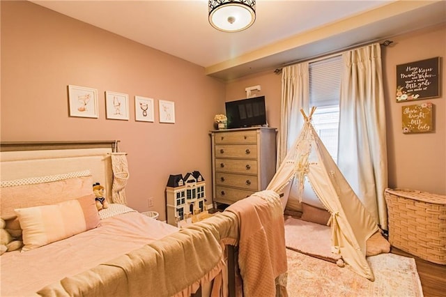 bedroom with hardwood / wood-style floors