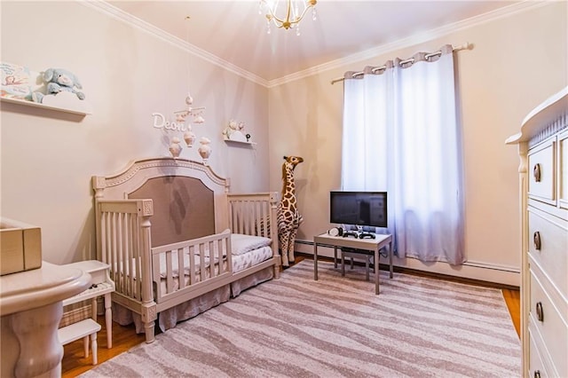 bedroom featuring ornamental molding, baseboard heating, a notable chandelier, light hardwood / wood-style floors, and a crib