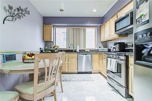 2572 W 16th St, Brooklyn, NY 11214 - kitchen featuring appliances with stainless steel finishes, light brown cabinetry, dark countertops, recessed lighting, and tasteful backsplash