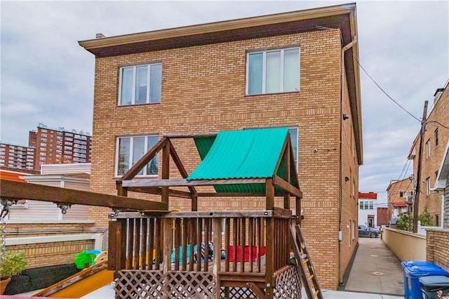 2572 W 16th St, Brooklyn, NY 11214 - back of house with brick siding and a playground