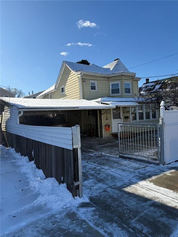 view of snow covered house