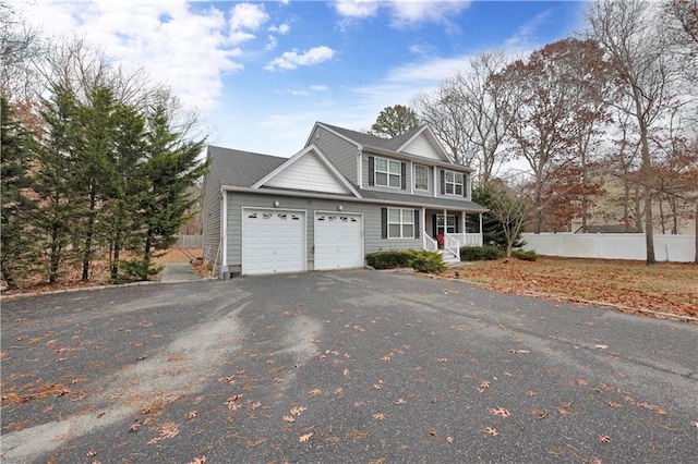 view of front property featuring a garage and covered porch