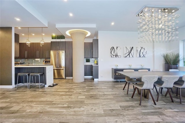 80 Bay St Unit 4A, Staten Island, NY 10301 - dining space with light wood-style flooring, recessed lighting, and decorative columns