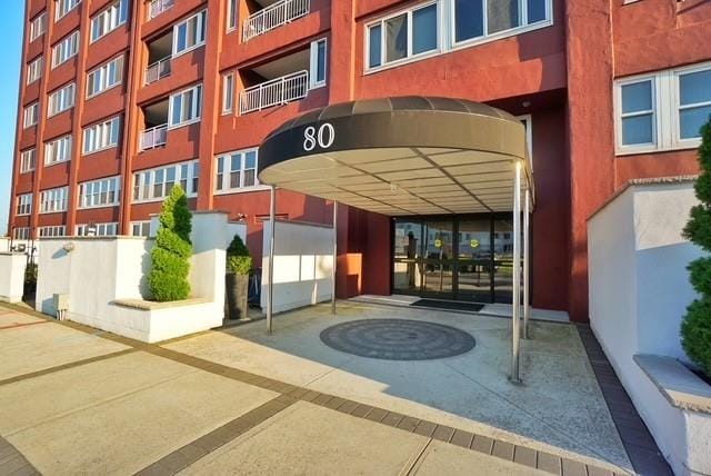 80 Bay St Unit 4A, Staten Island, NY 10301 - view of exterior entry featuring stucco siding