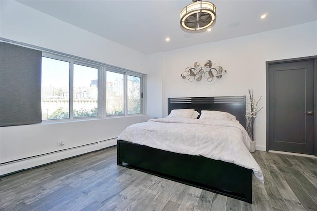 80 Bay St Unit 4A, Staten Island, NY 10301 - bedroom featuring baseboard heating, wood finished floors, and recessed lighting