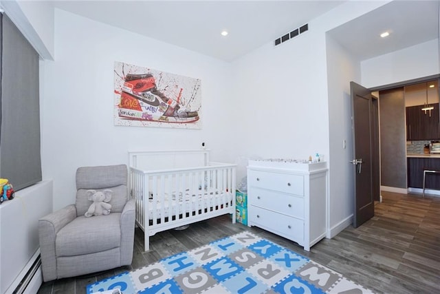 80 Bay St Unit 4A, Staten Island, NY 10301 - bedroom with a baseboard radiator, wood finished floors, a nursery area, recessed lighting, and baseboards