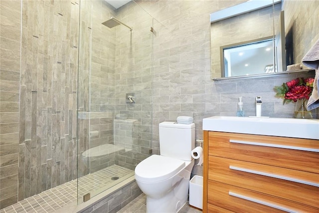 80 Bay St Unit 4A, Staten Island, NY 10301 - bathroom featuring a shower stall, toilet, vanity, and tile walls