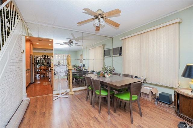 dining room featuring hardwood / wood-style floors, ceiling fan, and crown molding