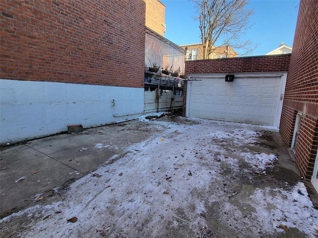 exterior space with a garage and an outdoor structure