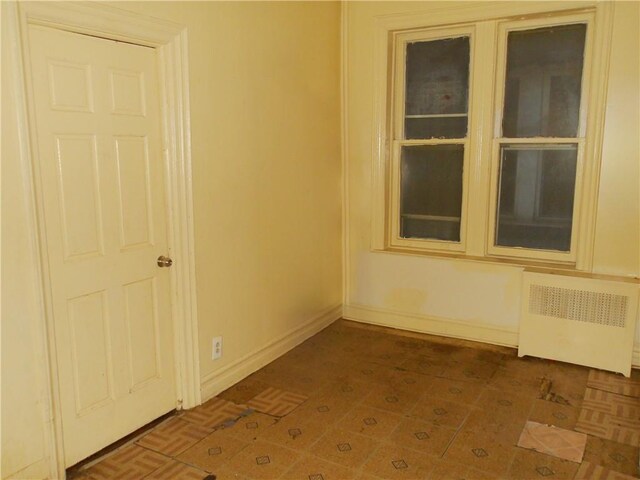 empty room featuring radiator