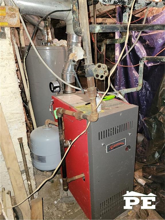 utility room with water heater