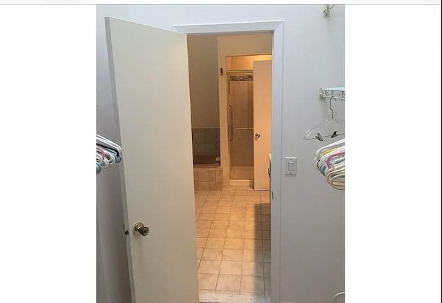 bathroom with tile patterned floors