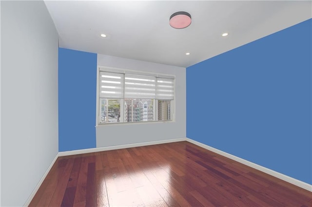 unfurnished room featuring hardwood / wood-style floors