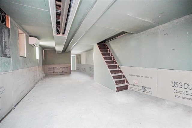 basement featuring an AC wall unit