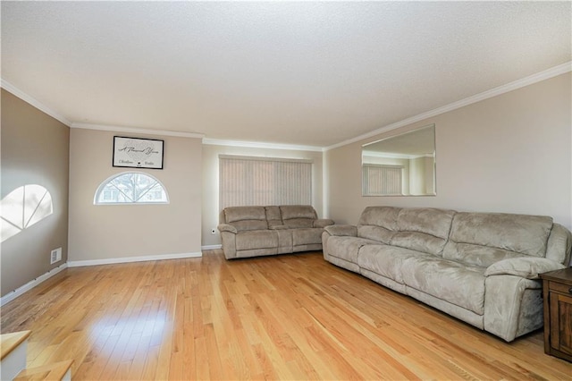 unfurnished living room with light hardwood / wood-style floors and ornamental molding