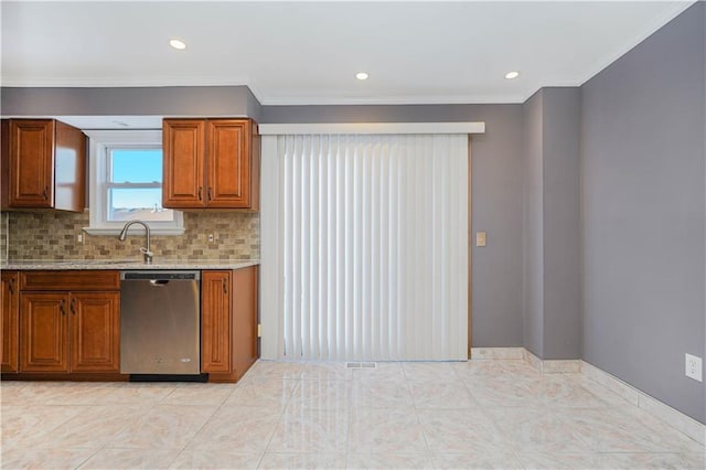 kitchen featuring tasteful backsplash, ornamental molding, sink, light tile patterned floors, and dishwasher