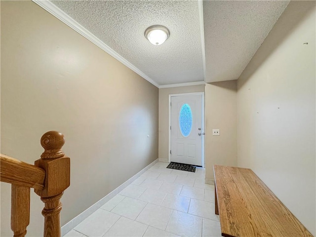 foyer featuring crown molding, light tile patterned floors, and a textured ceiling