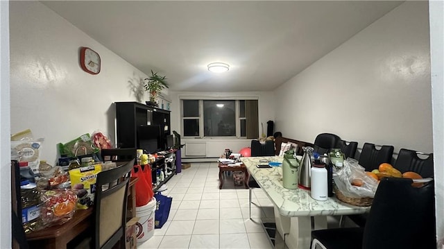 129 Bay 40th St, Brooklyn, NY 11214 - kitchen featuring light tile patterned floors, tile counters, and a baseboard heating unit