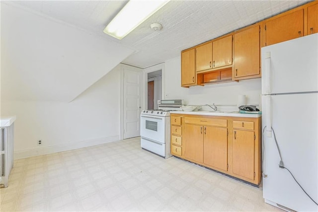 kitchen with baseboards, a sink, light countertops, white appliances, and light floors