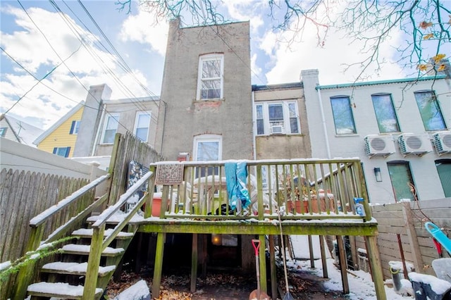 back of house featuring a deck