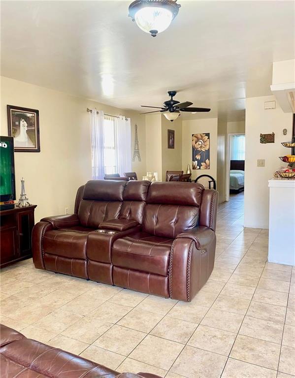 153 Hendrix St, Brooklyn, NY 11207 - living room featuring light tile patterned floors and a ceiling fan