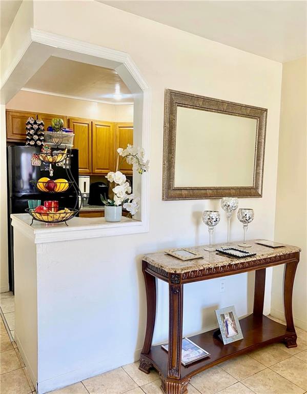 153 Hendrix St, Brooklyn, NY 11207 - interior space featuring light tile patterned floors and freestanding refrigerator