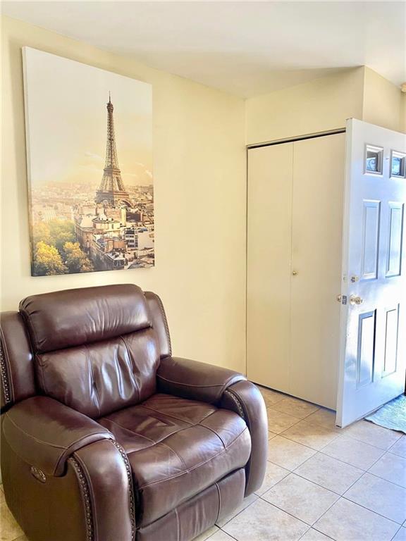 153 Hendrix St, Brooklyn, NY 11207 - living area featuring light tile patterned floors