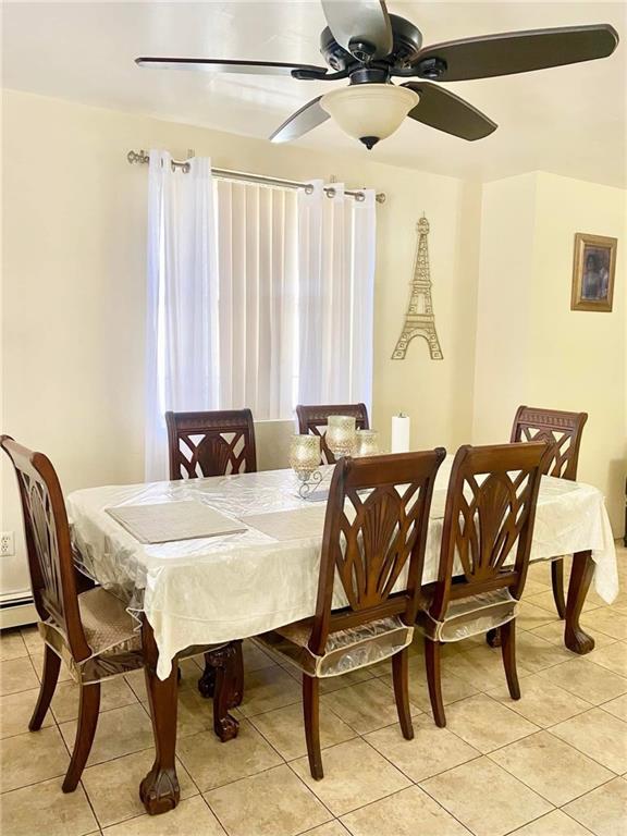 153 Hendrix St, Brooklyn, NY 11207 - dining area with light tile patterned floors and ceiling fan