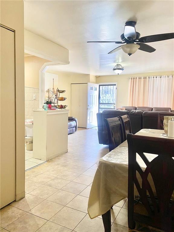 153 Hendrix St, Brooklyn, NY 11207 - dining space featuring light tile patterned flooring and ceiling fan
