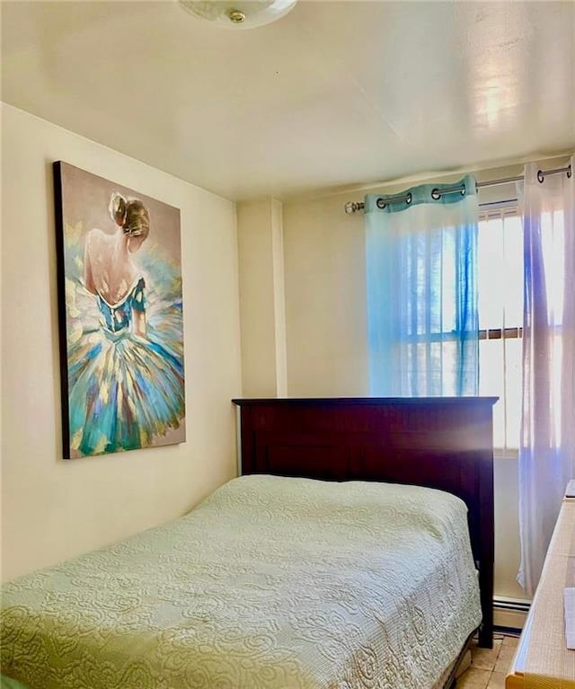153 Hendrix St, Brooklyn, NY 11207 - bedroom featuring a baseboard radiator and light tile patterned flooring