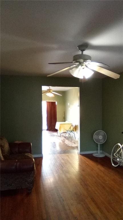 interior space featuring wood finished floors and baseboards