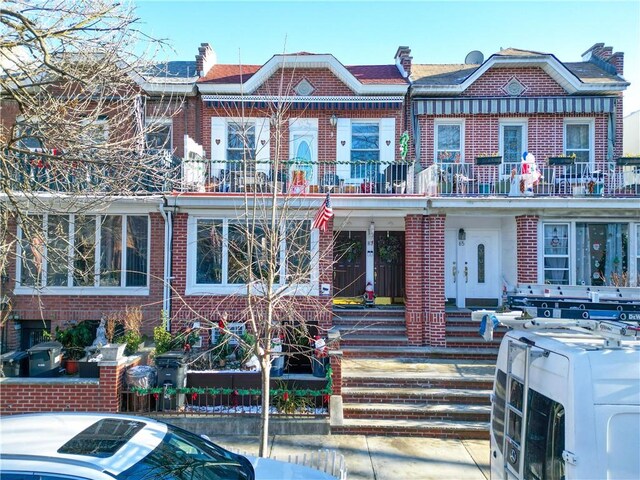 multi unit property featuring washer / clothes dryer and a balcony