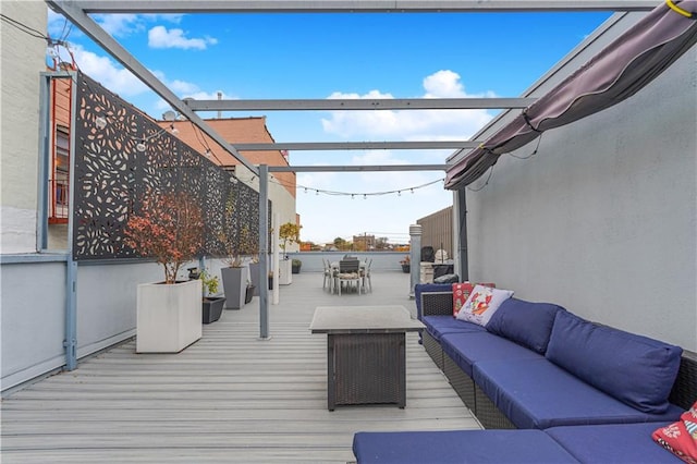 wooden terrace with outdoor dining area, outdoor lounge area, and a pergola