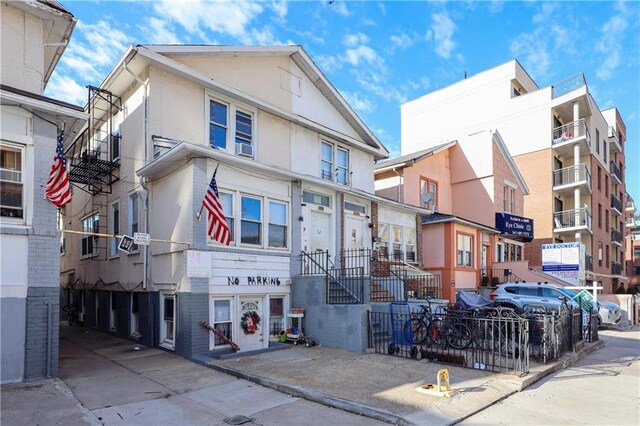 3022 Brighton 6th St, Brooklyn, NY 11235 - view of front of home featuring stucco siding