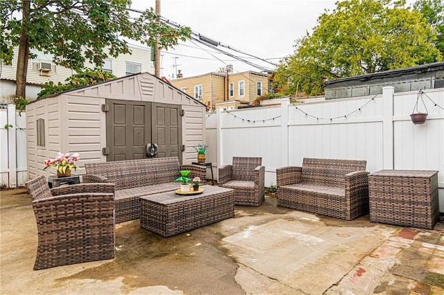 view of patio featuring a storage shed and an outdoor hangout area